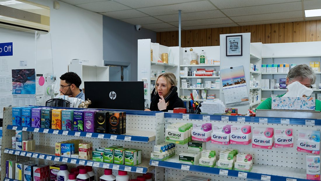Team members behind the pharmacy counter at Eastview Pharmacy