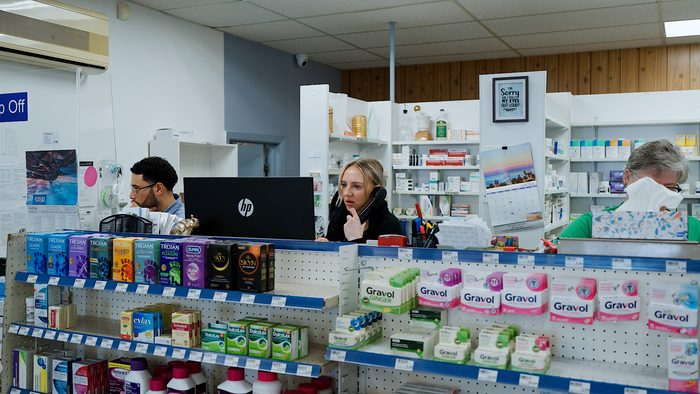 Team members behind the pharmacy counter