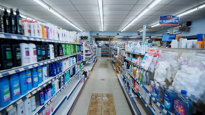 Aisle view looking toward the IDA cashier and pharmacy counter