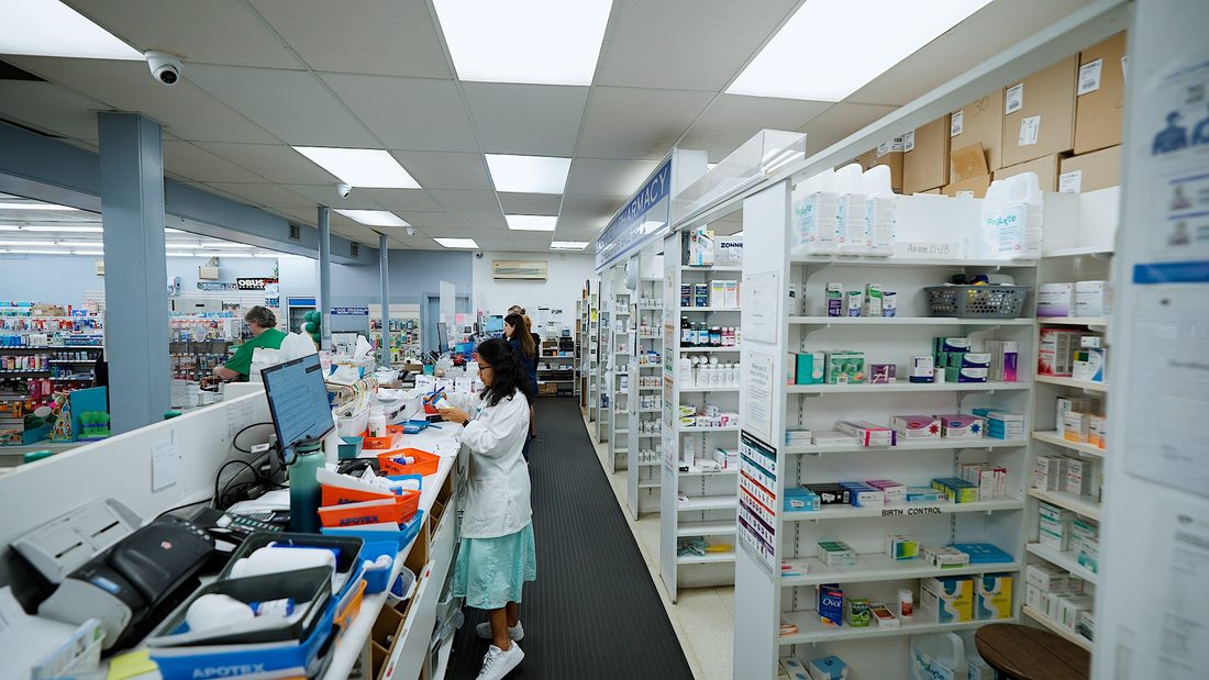 Eastview Pharmacy dispensing area with full shelves of medication